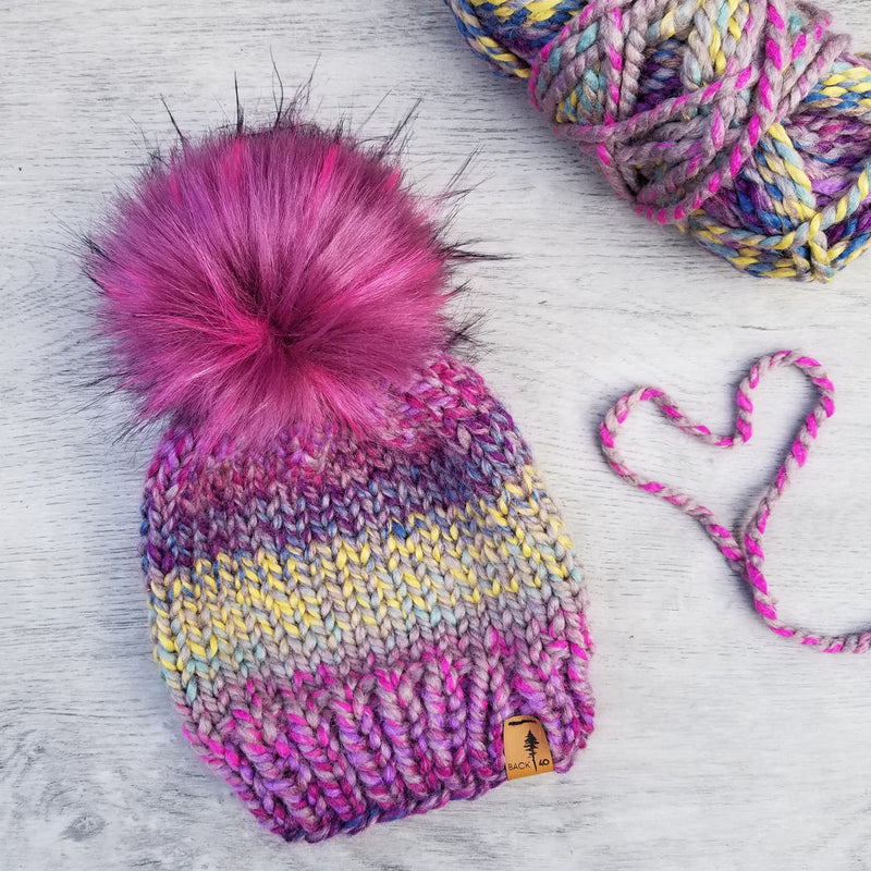 Classic Beanie in Astroland with Berry faux fur pom pom